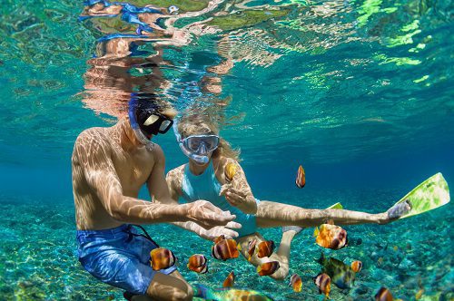 two people snorkeling